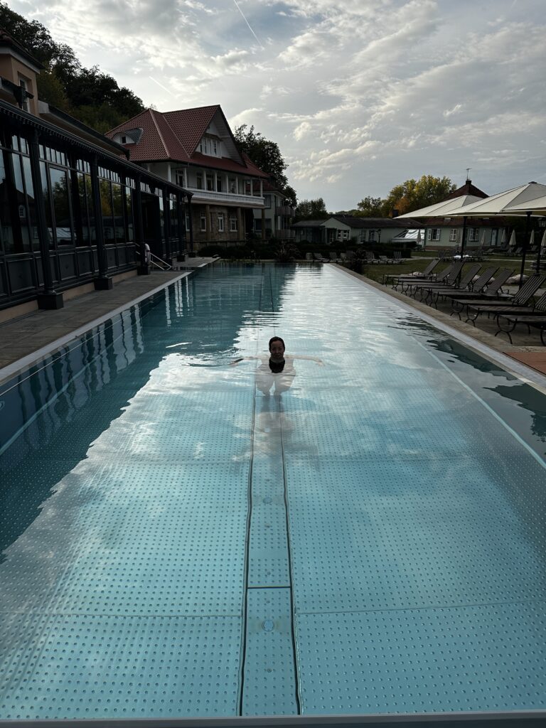 Amanda swimming in the outdoor heated pool at Bollants Im park